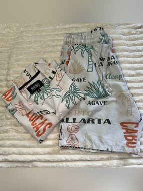 Malibu White Shorts with Green Palm & Orange Text Print
